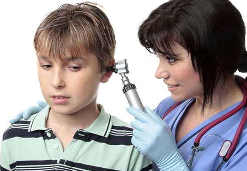 Doctor-examining-patient-before-pediatric-ear-surgery